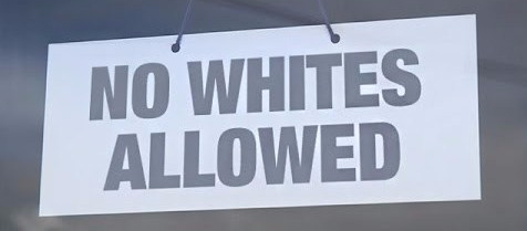 Board that says "No Whites Allowed"
